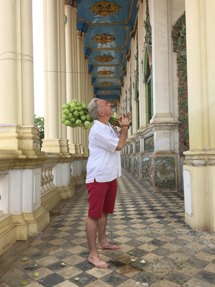 Morrison Polkingham holding lotus stems in Singapore